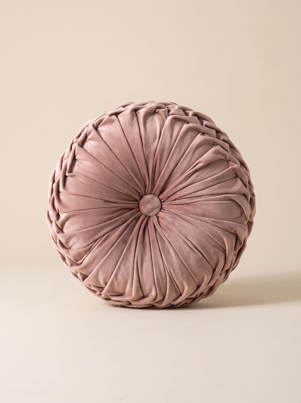 Le coussin rond en velours