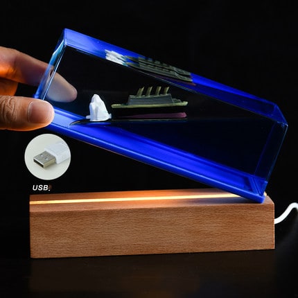 Unsinkable Ship Fluid Wave Paperweight with LED Light and Wooden Base - Image 6